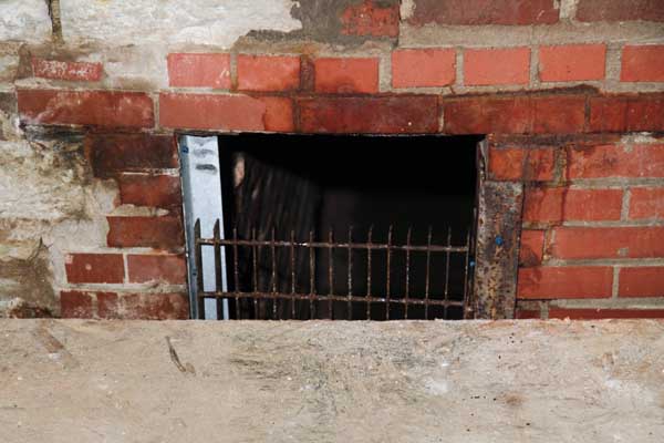 Here is a tunnel enterence that was bricked up years ago, but was partialy uncovered by the owners of the old building.  You can still see the old iron gate that kept it closed off to the wrong personelle.